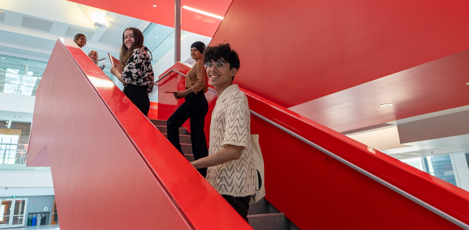 students on stairs at Mitchell Hall